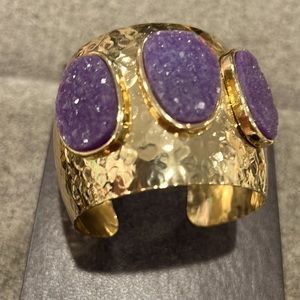 RJ Graziano chunky gold colored cuff bracelet with 3 amethyst stones.